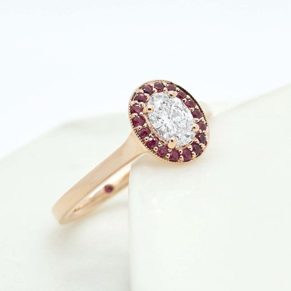 Oval diamond ruby halo rose gold engagement ring