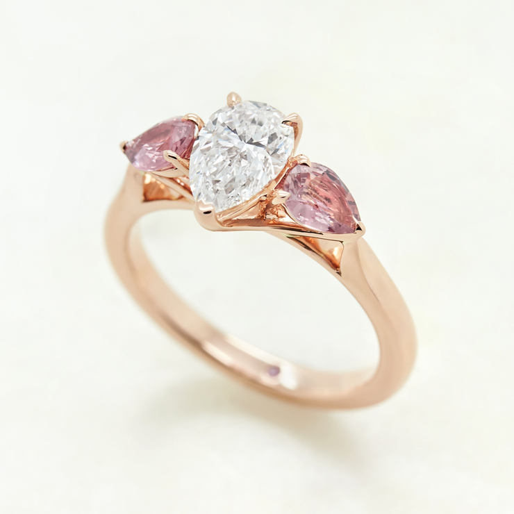 Rose gold pear diamond engagement ring with pear shaped pink sapphires
