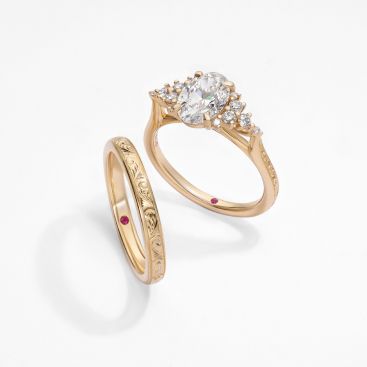 Matching engagement and wedding ring set oval diamond Marula design engraved band