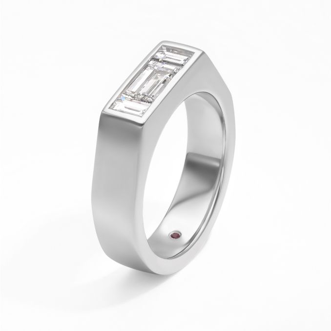Contemporary bold elongated emerald baguette diamond bezel set on chunky platinum band