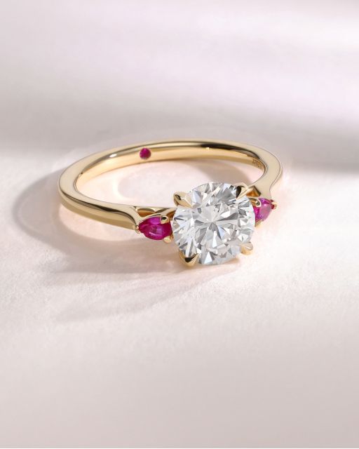 Faith round diamond pink pear side sapphires trilogy engagement ring yellow gold