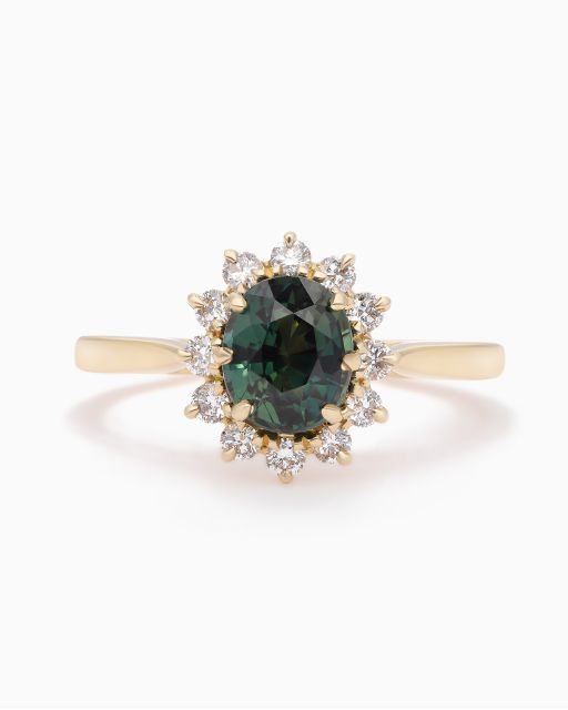 Forest green oval sapphire diamond halo engagement ring yellow gold