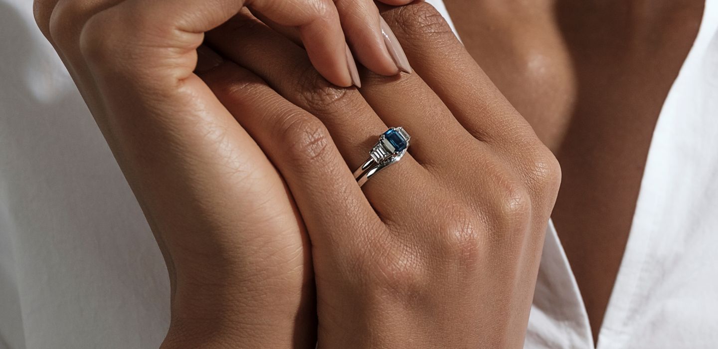 Teal sapphire engagement ring five stone diamond baguettes with matching curved wedding ring band