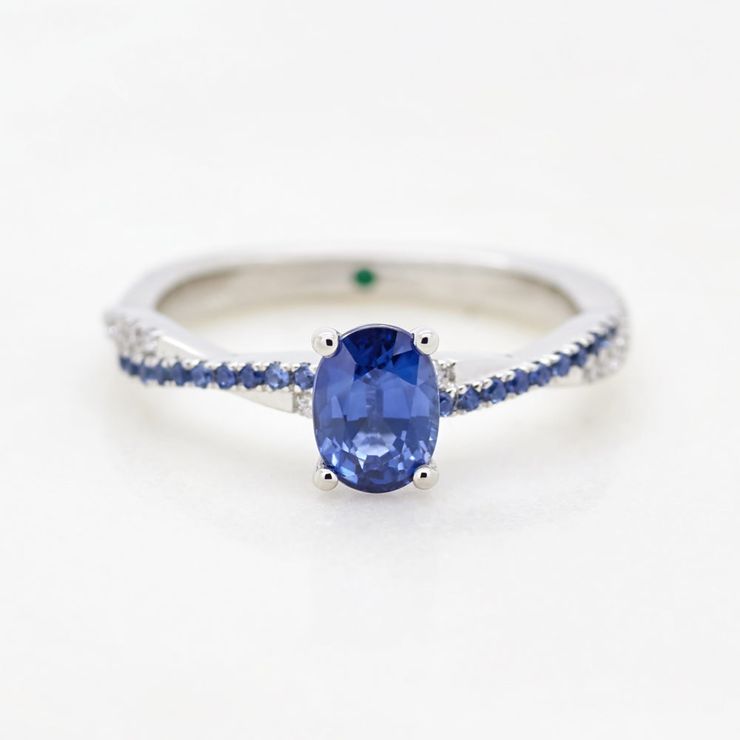 Blue oval sapphire twist band diamond pave white gold