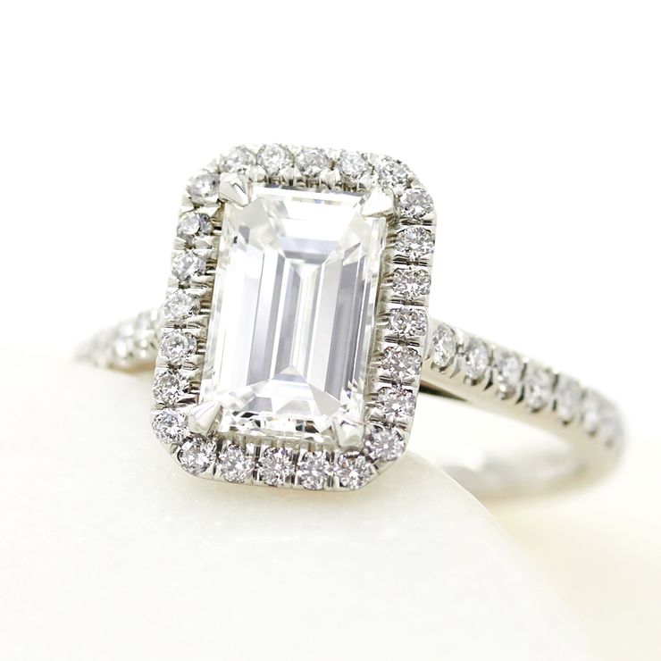 Emerald cut diamond platinum halo engagement ring