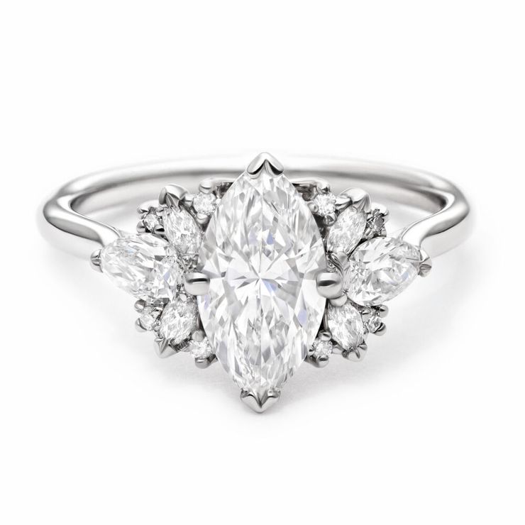 Marquise diamond with fanned marquise and pear cluster stones engagement ring set in platinum
