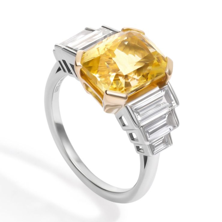 Radiant yellow sapphire engagement ring with descending straight diamond baguette accent stones