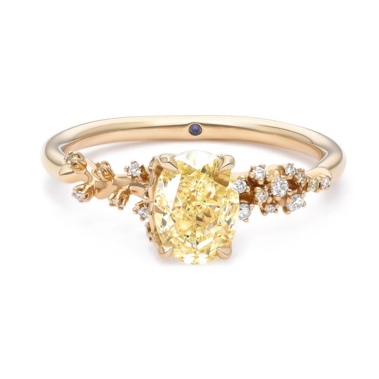 Organic blossom inspired oval yellow diamond engagement ring with white diamond buds