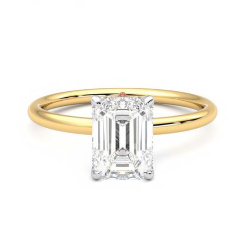 Demure mixed metal emerald diamond solitaire