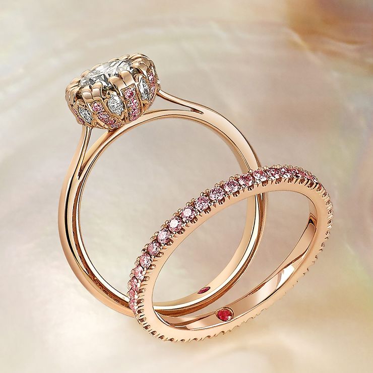 18K rose gold solitaire with white pink diamonds set in the gallery matching wedding band