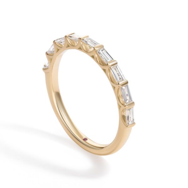 Custom diamond baguette wedding ring with scalloped setting style in yellow gold