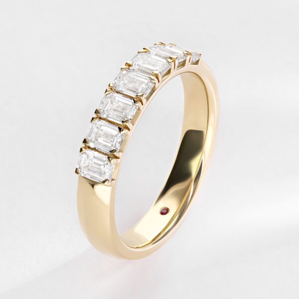 Emerald cut diamond 1/4 eternity pavé wedding ring in yellow gold