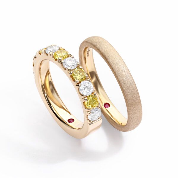 Matching yellow wedding ring set with yellow and white diamond pave and sandblasted texture finish