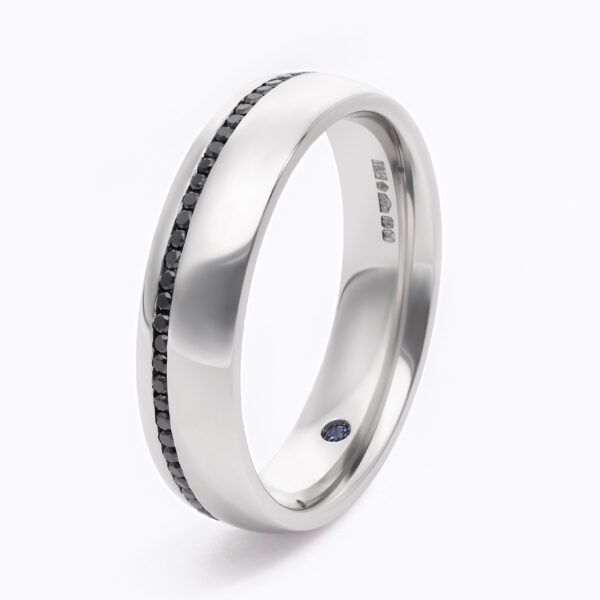 Custom wedding ring with brushed texture and black diamond pavé in platinum