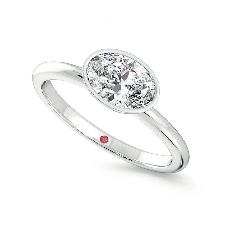 Oval east west bezel set engagement ring