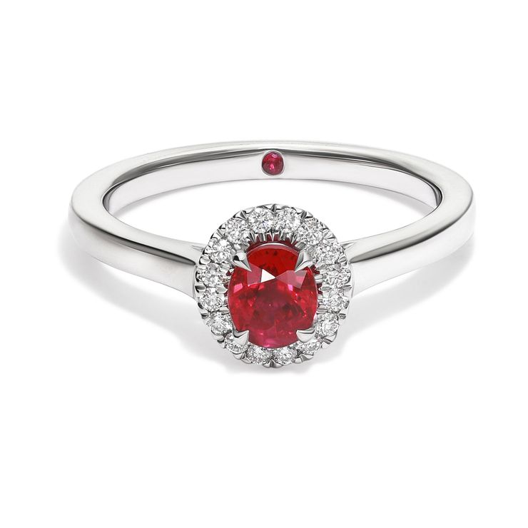 Oval ruby diamond halo engagement ring platinum