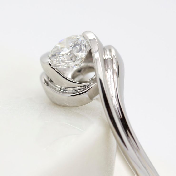 Tension set engagement ring