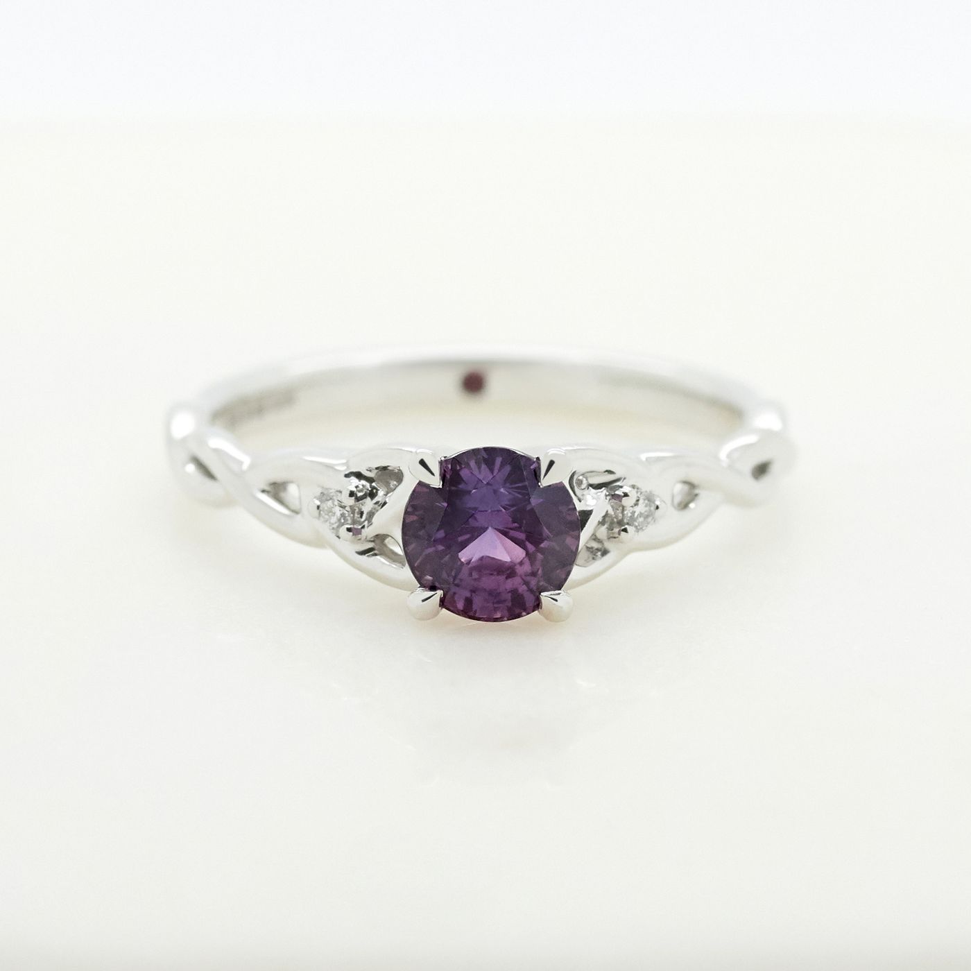 Dark purple round sapphire engagement ring set with platinum