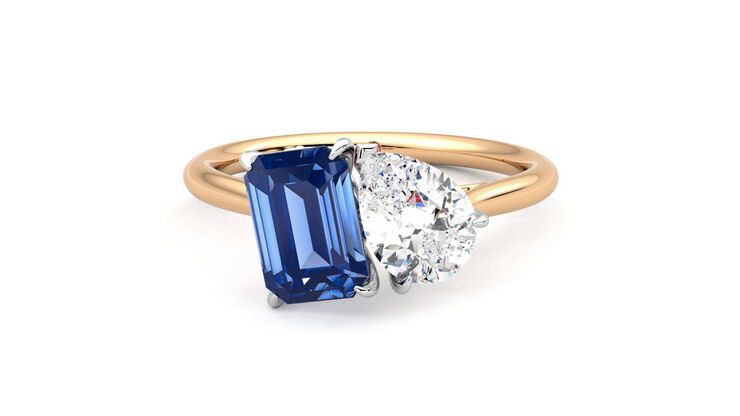 Pear diamond and a 0.95ct emerald cut blue sapphire engagement ring set in platinum with an 18ct rose gold band