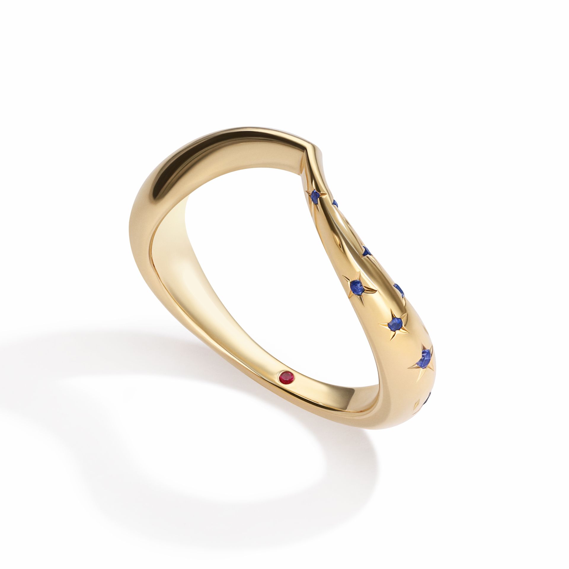 asymmetrical chevron wedding ring yellow gold star set blue sapphires