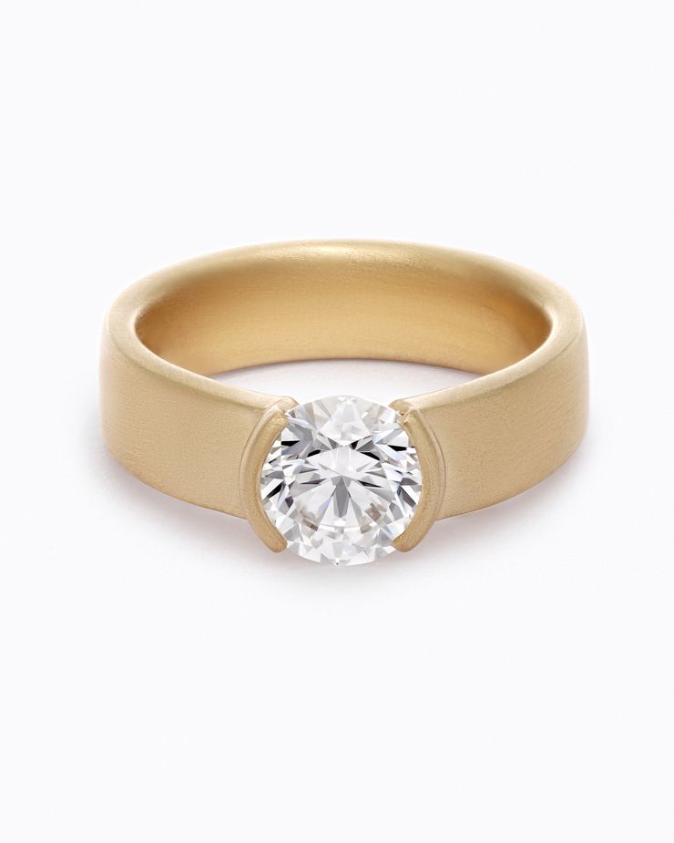 Brushed yellow gold wide engagement ring with half bezel set round diamond