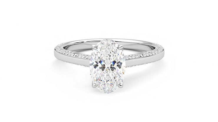 Oval solitaire with clusters of bevelled diamond pavé engagement ring set in 18ct white gold