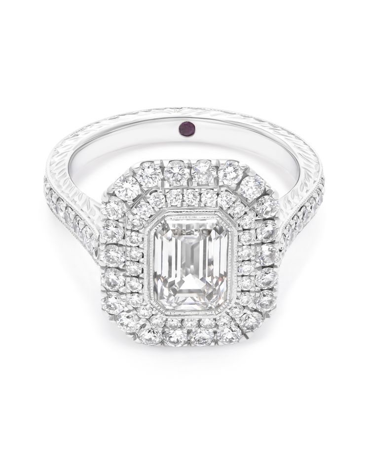 Custom emerald cut diamond centre with double halo engagement ring engraving filigree platinum