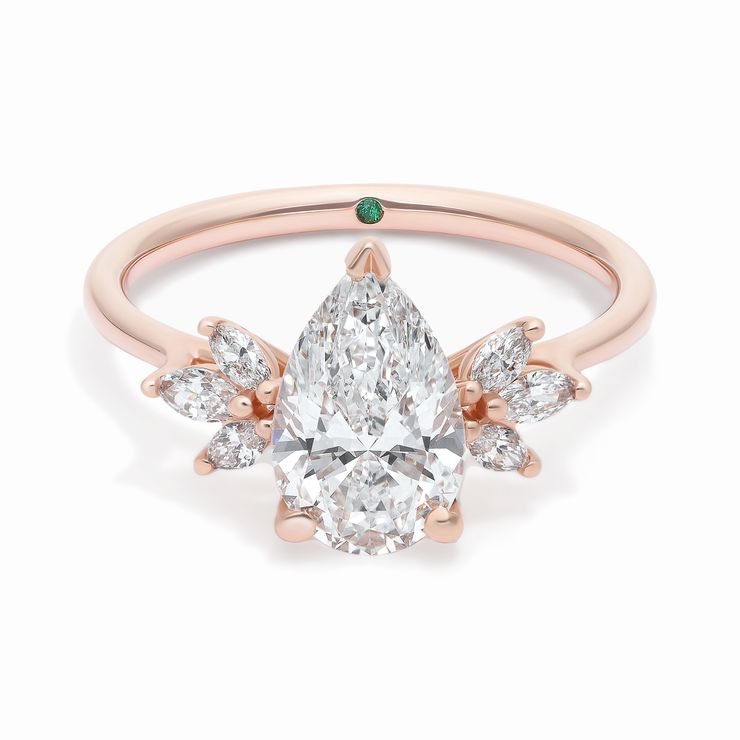 Pear diamond cluster diamong engagement ring with marquise diamond accent stones in rose gold