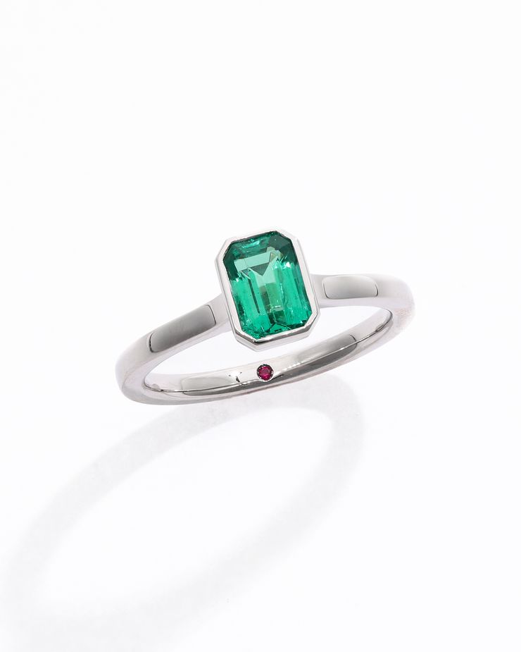 Emerald cut emerald bezel setting engagement ring platinum