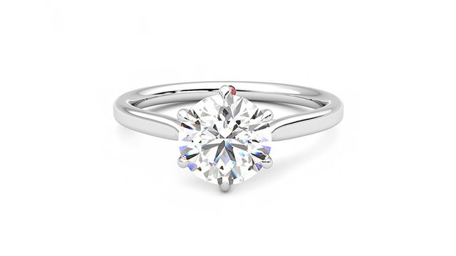 Round solitaire engagement ring with six eagle claws set in 18ct white gold