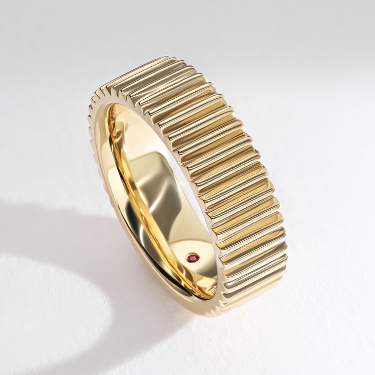 Chunky yellow gold band with ridged texture and effect