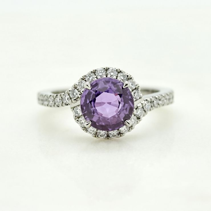 Round purple sapphire set in platinum with pavé