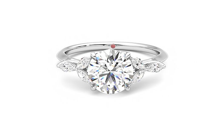 Round engagement ring and marquise diamond petals on a knife edge band