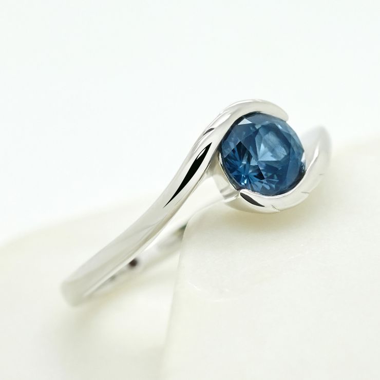 Tension set twisted engagement ring blue sapphire platinum