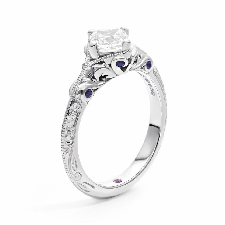 Vintage inspired cushion cut diamond engagement ring with engraving filigiree and hidden blue sapphires