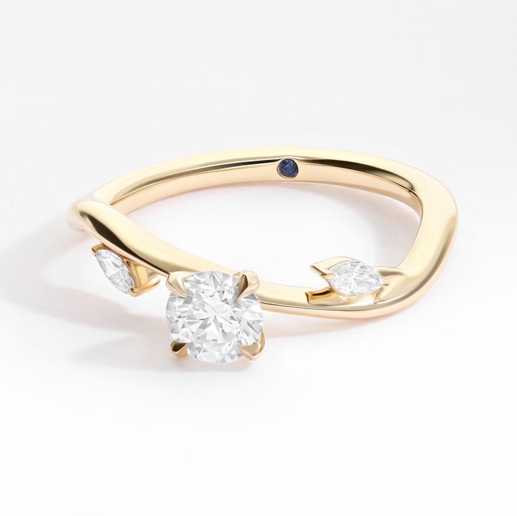 Contemporary yellow gold round diamond loose leaf marquise diamond nature inspired organic forms structural sweeping engagement ring