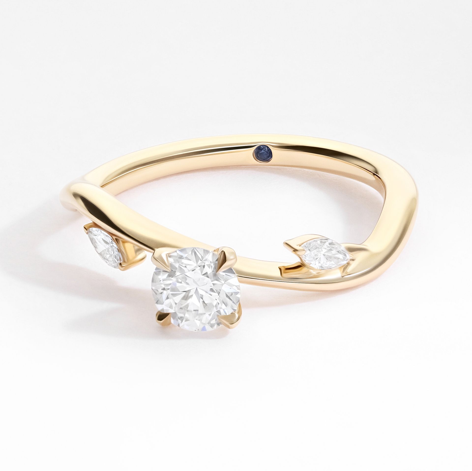 Contemporary yellow gold round diamond loose leaf marquise diamond nature inspired organic forms structural sweeping engagement ring