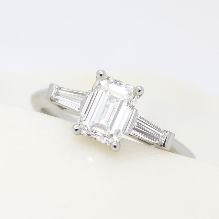 Emerald cut diamond ring with tapered diamond baguettes