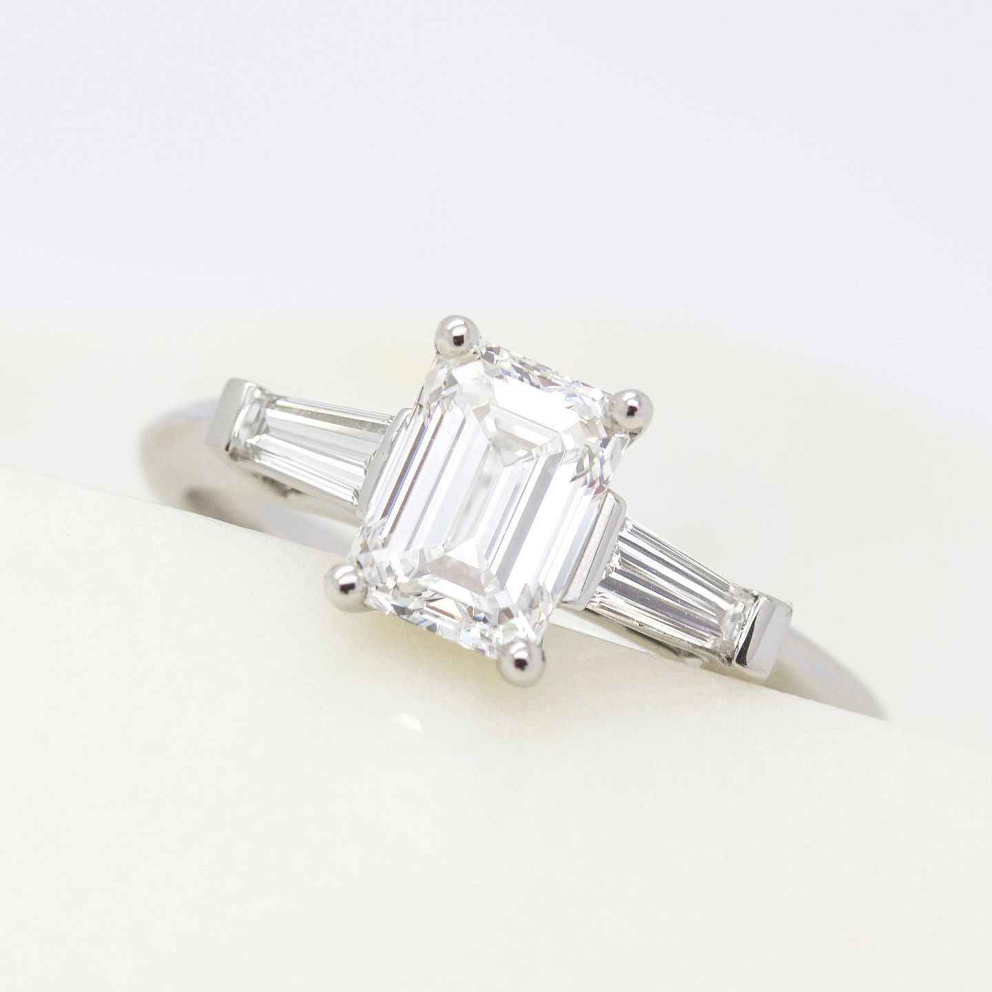 Emerald cut diamond ring with tapered diamond baguettes