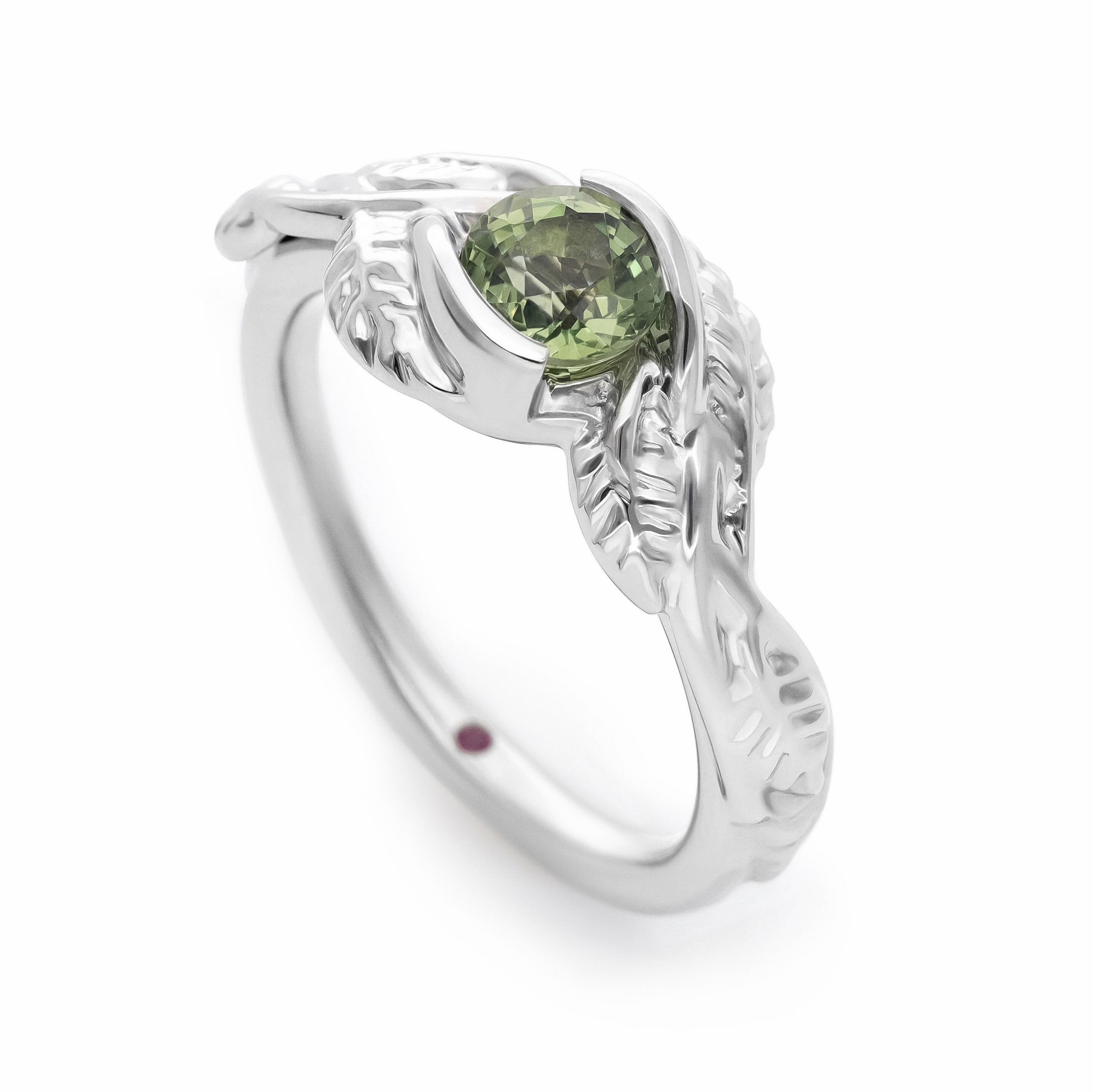 Floral organic round green sapphire with twisted polished platinum leaf detail band