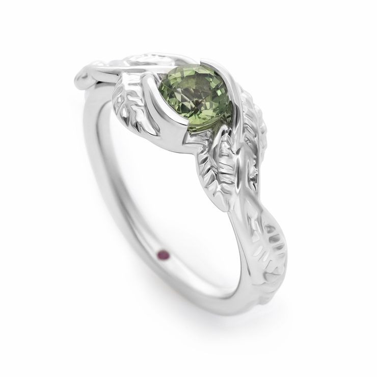 Organic inspired round green sapphire engagement ring with twisted leaf engraved band