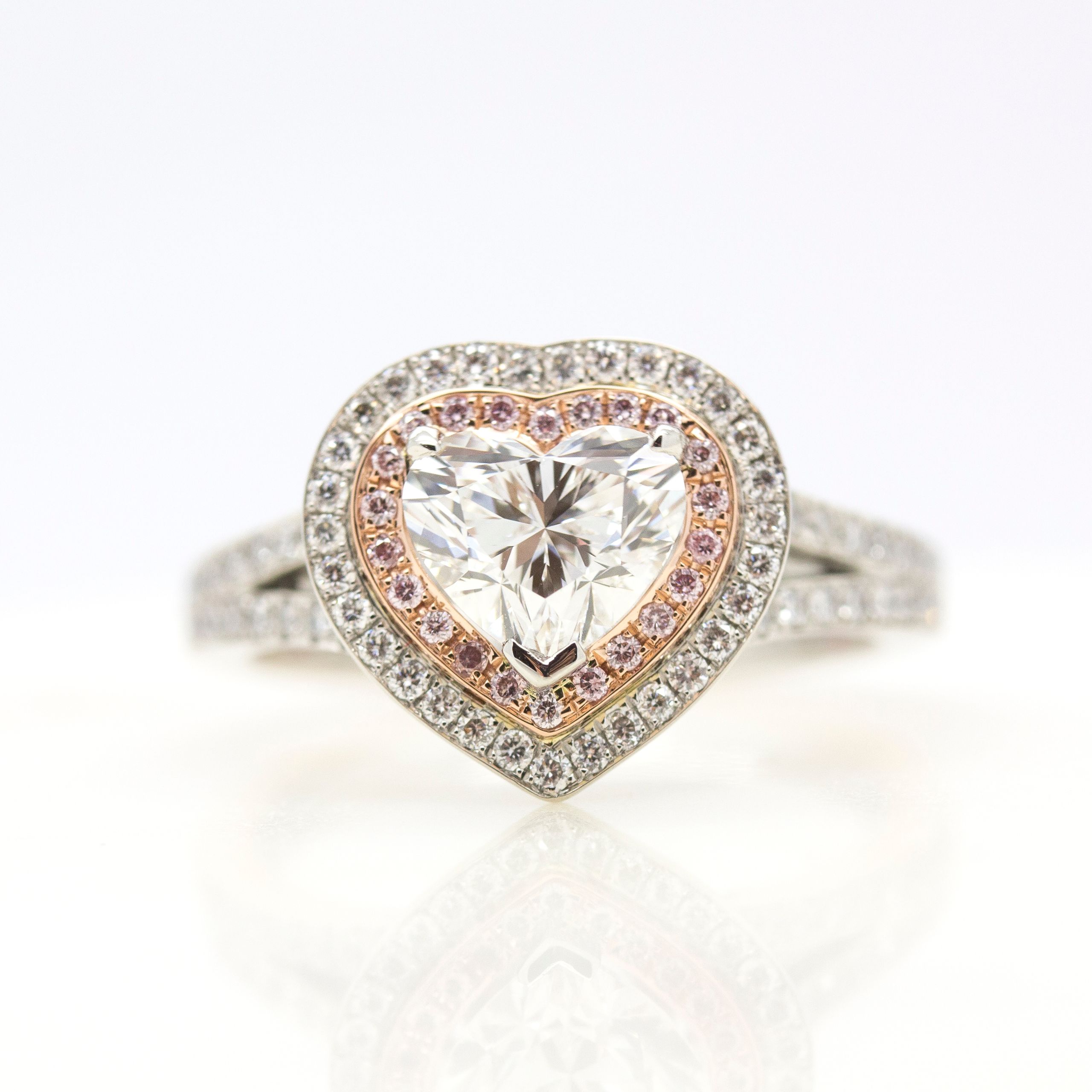 Heart shaped diamond pink and white diamond halo engagement ring