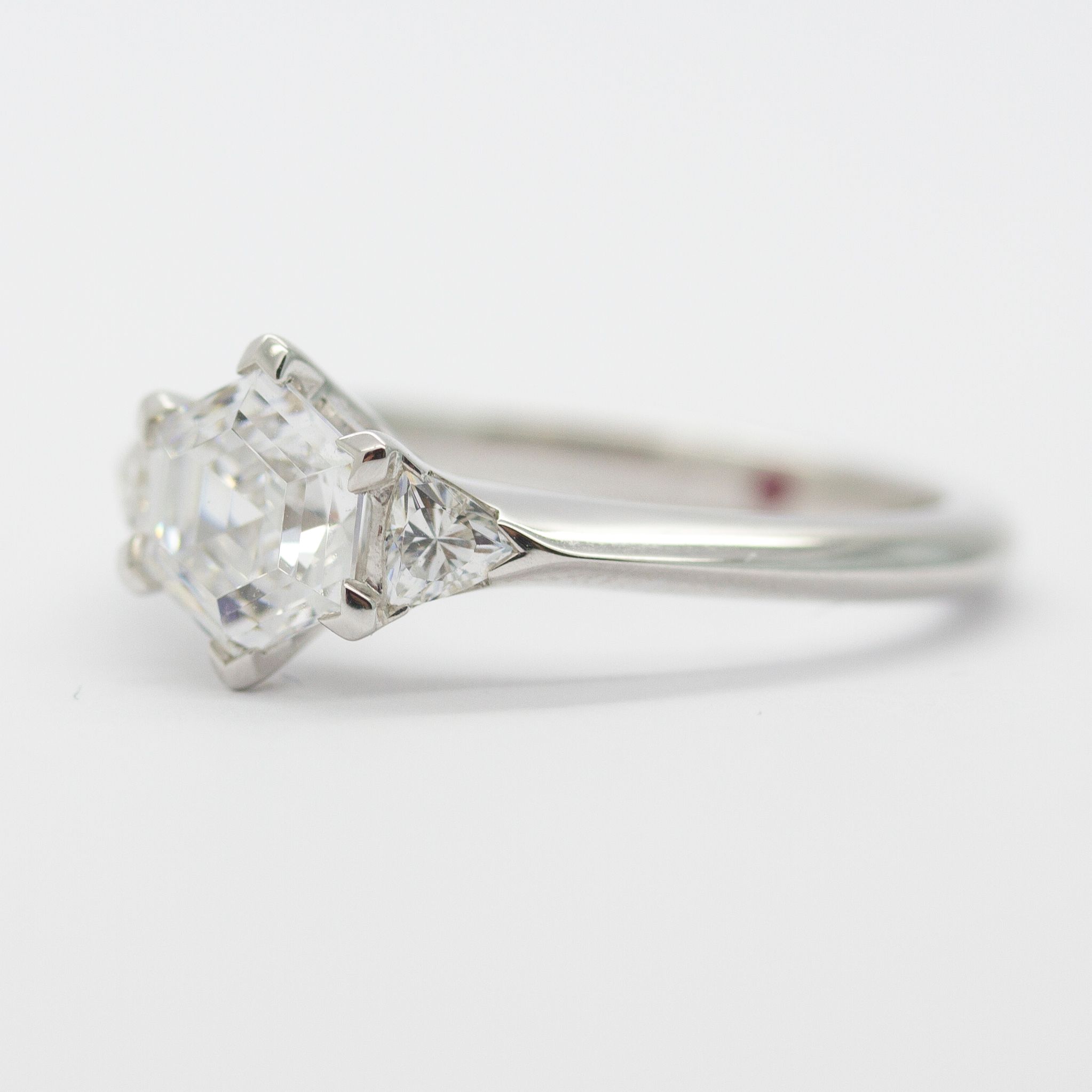 Hexagon centre diamond with trilliant side diamonds