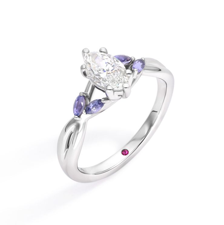 Asymmetric marquise diamond engagement ring with purple marquise sapphire accent stones