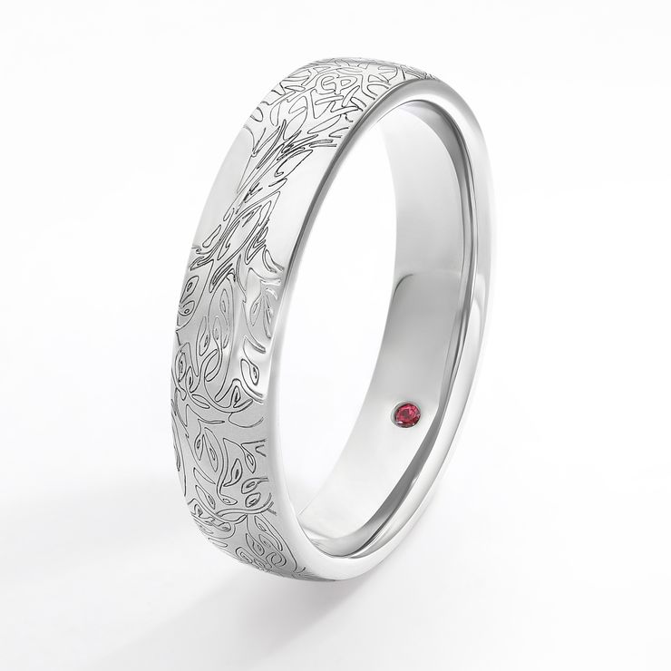 Platinum wedding band with organic engraving pattern