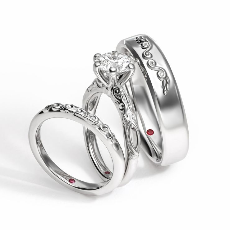 Organic inspired swirl raised relief metalwork platinum engagement and wedding ring set