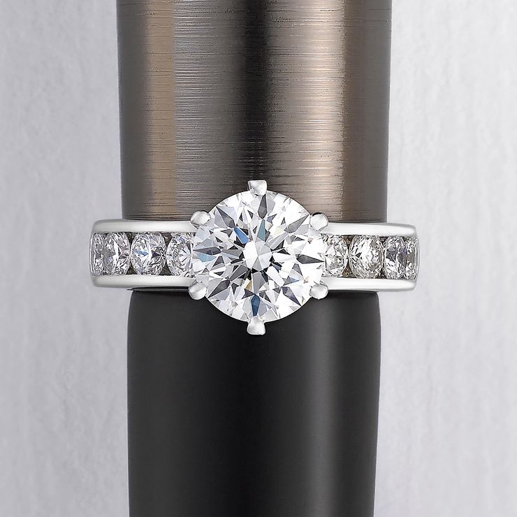 Round diamond with channel set diamonds