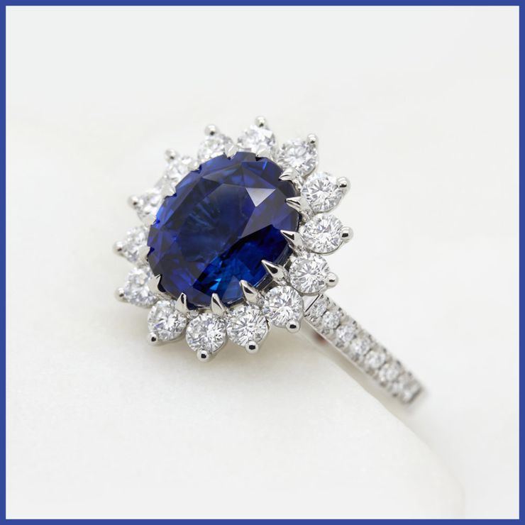 Blue oval sapphire floral engagement ring