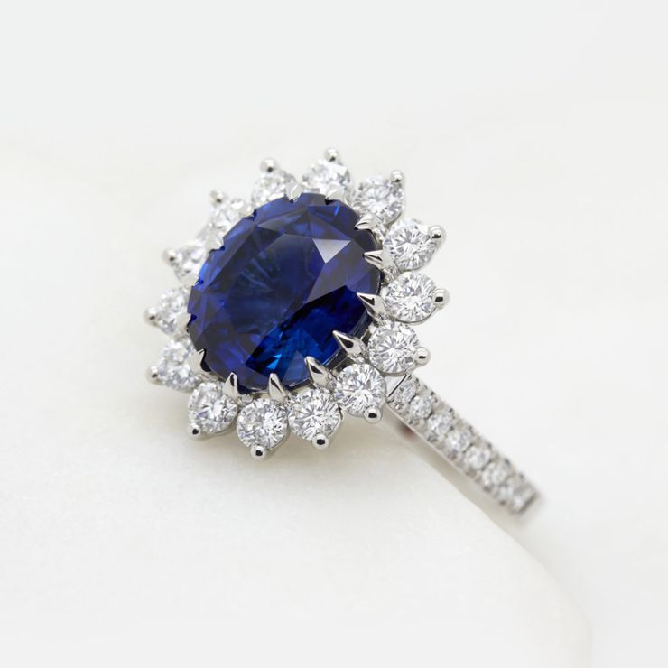 Blue oval sapphire floral engagement ring