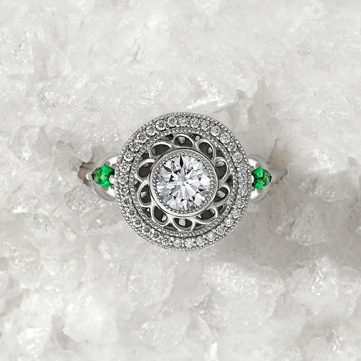 Round centre diamond, diamond and filigree detail halo with Marquise tsavorites set in platinum